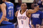 OKLAHOMA CITY, OK - MAY 21:  Russell Westbrook #0 of the Oklahoma City Thunder points in the third quarter while taking on the Dallas Mavericks in Game Three of the Western Conference Finals during the 2011 NBA Playoffs at Oklahoma City Arena on May 21, 2011 in Oklahoma City, Oklahoma. NOTE TO USER: User expressly acknowledges and agrees that, by downloading and or using this photograph, User is consenting to the terms and conditions of the Getty Images License Agreement.  (Photo by Christian Petersen/Getty Images)
