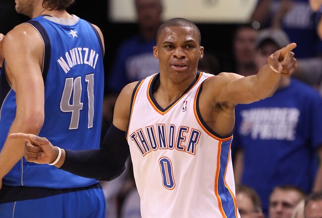 OKLAHOMA CITY, OK - MAY 21:  Russell Westbrook #0 of the Oklahoma City Thunder points in the third quarter while taking on the Dallas Mavericks in Game Three of the Western Conference Finals during the 2011 NBA Playoffs at Oklahoma City Arena on May 21, 2011 in Oklahoma City, Oklahoma. NOTE TO USER: User expressly acknowledges and agrees that, by downloading and or using this photograph, User is consenting to the terms and conditions of the Getty Images License Agreement.  (Photo by Christian Petersen/Getty Images)