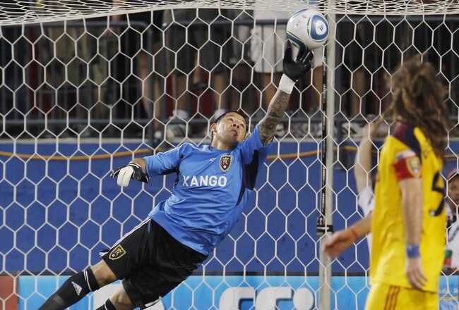 FRISCO, TX - MAY 22: Kyle Beckerman #5 of Real Salt Lake watches as goalkeeper Nick Rimando #18 deflects a FC Dallas shot with his finger tips during the first half of a soccer game at Pizza Hut Park on May 22, 2011 in Frisco, Texas. (Photo by Brandon Wade/Getty Images)