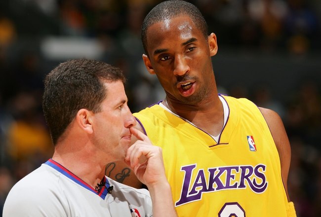 LOS ANGELES, CA - APRIL 28:  Kobe Bryant #8 of the Los Angeles Lakers talks to referee Tim Donaghy #21, in the first half against the Phoenix Suns in Game Three of the Western Conference Quarterfinals during the 2006 NBA Playoffs April 28, 2006 at Staples Center in Los Angeles, California.  (Photo by Lisa Blumenfeld/Getty Images)