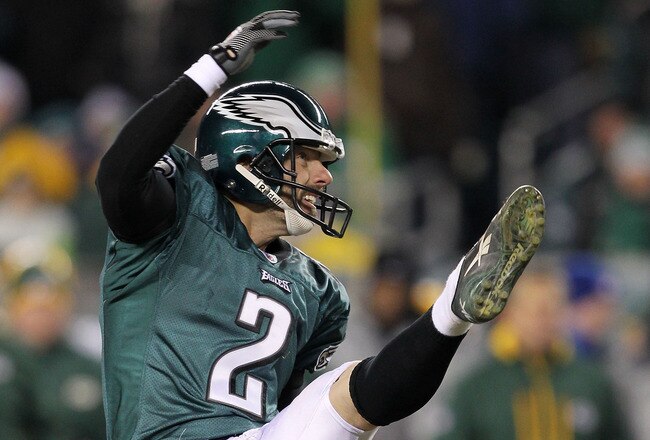 PHILADELPHIA, PA - JANUARY 09:  David Akers #2 kicks as Sav Rocca #6 of the Philadelphia Eagles holds against the Green Bay Packers during the 2011 NFC wild card playoff game at Lincoln Financial Field on January 9, 2011 in Philadelphia, Pennsylvania.  (Photo by Al Bello/Getty Images)