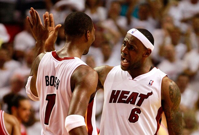MIAMI, FL - MAY 22:  LeBron James #6 (R) and Chris Bosh #1 of the Miami Heat celebrate against the Chicago Bulls in the fourth quarter of Game Three of the Eastern Conference Finals during the 2011 NBA Playoffs on May 22, 2011 at American Airlines Arena in Miami, Florida.  NOTE TO USER: User expressly acknowledges and agrees that, by downloading and or using this photograph, User is consenting to the terms and conditions of the Getty Images License Agreement.  (Photo by Marc Serota/Getty Images)