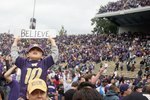 SEATTLE - SEPTEMBER 19: Players and fans celebrate the Washington Huskies' 16-13 defeat of the USC Trojans on September 19, 2009 at Husky Stadium in Seattle, Washington. (Photo by Otto Greule Jr/Getty Images)
