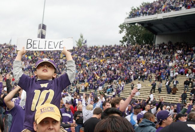 SEATTLE - SEPTEMBER 19: Players and fans celebrate the Washington Huskies' 16-13 defeat of the USC Trojans on September 19, 2009 at Husky Stadium in Seattle, Washington. (Photo by Otto Greule Jr/Getty Images)