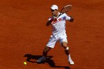 PARIS, FRANCE - MAY 23:  Novak Djokovic of Serbia hits a forehand during the men's singles first round match between Thiemo De Bakker of Netherlands and Novak Djokovic of Serbia on day two of the French Open at Roland Garros on May 23, 2011 in Paris, France.  (Photo by Alex Livesey/Getty Images)
