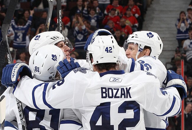 OTTAWA, CANADA - APRIL 2: Tyler Bozak #42 of the Toronto Maple Leafs celebrates his third period goal with team mates Phil Kessel #81Carl Gunnarsson #36 against the Ottawa Senators at Scotiabank Place on April 2, 2011 in Ottawa, Ontario, Canada.  (Photo by Jana Chytilova/Freestyle Photography/Getty Images)