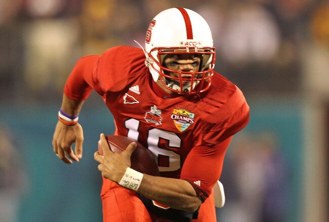 ORLANDO, FL - DECEMBER 28:  Russell Wilson #16 of the North Carolina State Wolfpack rushes with the ball during the Champs Sports Bowl against the West Virginia Mountineers at Florida Citrus Bowl Stadium on December 28, 2010 in Orlando, Florida.  (Photo by Mike Ehrmann/Getty Images)