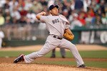 OAKLAND, CA - JULY 19:  Daisuke Matsuzaka #18 of the Boston Red Sox pitches against the Oakland Athletics at the Oakland-Alameda County Coliseum  on July 19, 2010 in Oakland, California.  (Photo by Ezra Shaw/Getty Images)