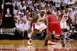 MIAMI, FL - MAY 24:  LeBron James #6 of the Miami Heat defends Derrick Rose #1 of the Chicago Bulls in Game Four of the Eastern Conference Finals during the 2011 NBA Playoffs on May 24, 2011 at American Airlines Arena in Miami, Florida. The Heat won 101-93 in overtime. NOTE TO USER: User expressly acknowledges and agrees that, by downloading and or using this photograph, User is consenting to the terms and conditions of the Getty Images License Agreement.  (Photo by Mike Ehrmann/Getty Images)