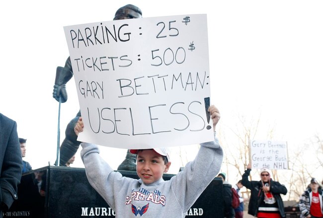 MONTREAL, CANADA - MARCH 15:  A young fan holds a sign during a protest denouncing 'headshots' and NHL Commissioner Gary Bettman (not pictured) prior to the NHL game between the Montreal Canadiens and the Washington Capitals at the Bell Centre on March 15, 2011 in Montreal, Quebec, Canada.  (Photo by Richard Wolowicz/Getty Images)
