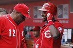 CINCINNATI, OH - MAY 14: Brandon Phillips #4 of the Cincinnati Reds talks with manager Dusty Baker during the game against the St. Louis Cardinals at Great American Ball Park on May 14, 2011 in Cincinnati, Ohio. The Reds defeated the Cardinals 7-3. (Photo by Joe Robbins/Getty Images)