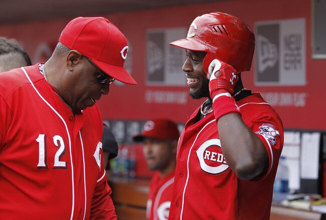 CINCINNATI, OH - MAY 14: Brandon Phillips #4 of the Cincinnati Reds talks with manager Dusty Baker during the game against the St. Louis Cardinals at Great American Ball Park on May 14, 2011 in Cincinnati, Ohio. The Reds defeated the Cardinals 7-3. (Photo by Joe Robbins/Getty Images)