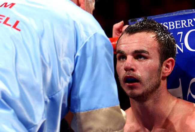 NEWCASTLE UPON TYNE, ENGLAND - DECEMBER 05:  Kevin Mitchell listens to his trainer Jimmy Tibbs during his WBO intercontinental fight against Breidis Prescott  on December 5, 2009 in Newcastle upon Tyne, England.  (Photo by John Gichigi/Getty Images)