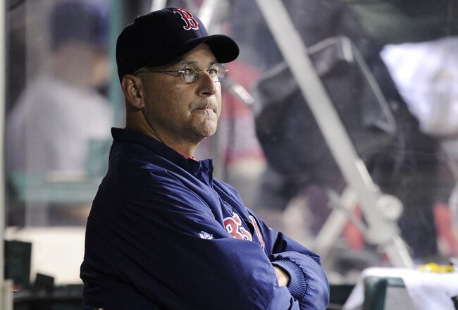 ANAHEIM, CA - OCTOBER 08:  Manager Terry Francona of the Boston Red Sox watches from the dugout during Game One of the ALDS against the Los Angeles Angels of Anaheim at Angel Stadium on October 8, 2009 in Anaheim, California. (Photo by Kevork Djansezian/Getty Images)
