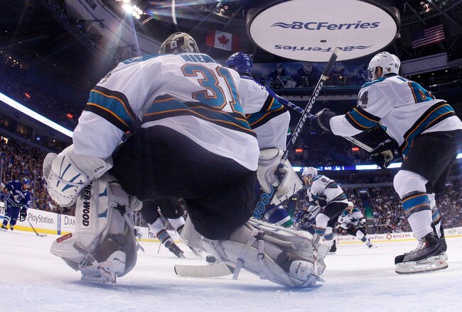VANCOUVER, CANADA - MAY 24:  Goaltender Antti Niemi #31 of the San Jose Sharks gets in position against the San Jose Sharks as Daniel Sedin #22 of the Vancouver Canucks shoots from the right wing in Game Five of the Western Conference Finals during the 2011 Stanley Cup Playoffs at Rogers Arena on May 24, 2011 in Vancouver, British Columbia, Canada. (Photo by Harry How/Getty Images)