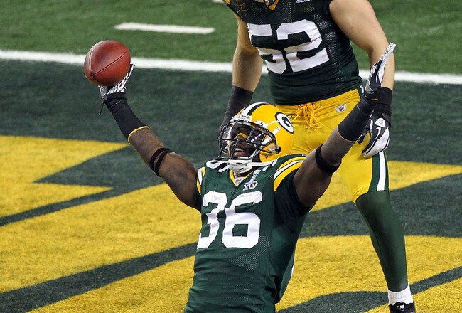 ARLINGTON, TX - FEBRUARY 06:  Nick Collins #36 of the Green Bay Packers celebrates with teammate Clay Matthews #52 after Collins returned an interception for a touchdown against the Pittsburgh Steelers during Super Bowl XLV at Cowboys Stadium on February 6, 2011 in Arlington, Texas. The Packers won 31-25.  (Photo by Mike Ehrmann/Getty Images)