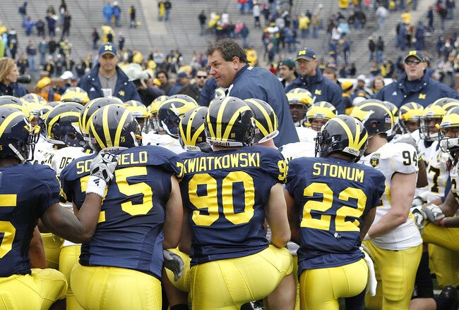 ANN ARBOR, MI - APRIL 16:  Head football coach Brady Hoke talks with his team during the annual Spring Game at Michigan Stadium on April 16, 2011 in Ann Arbor, Michigan.  (Photo by Leon Halip/Getty Images)