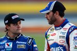 CHARLOTTE, NC - MAY 26:  Jimmie Johnson (R), driver of the #48 Lowe's Summer Salute Chevrolet, walks with Ricky Stenhouse Jr. (L), driver of the #21 Motorcraft/Quick Lane Tire & Auto Center Ford, on the grid during qualifying for the NASCAR Sprint Cup Series Coca-Cola 600 at Charlotte Motor Speedway on May 26, 2011 in Charlotte, North Carolina.  (Photo by Chris Graythen/Getty Images)