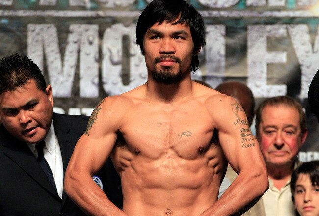 LAS VEGAS, NV - MAY 06:  Boxer Manny Pacquiao of the Philippines steps on the scale at 145 pounds before his WBO welterweight title fight against Shane Mosley at MGM Grand Garden Arena on May 6, 2011 in Las Vegas, Nevada. Pacquiao will defend his WBO welterweight title against Mosley on May 7, 2011 in Las Vegas  (Photo by Chris Trotman/Getty Images)