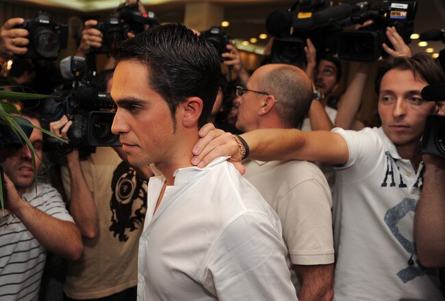 PINTO, SPAIN - SEPTEMBER 30:  Alberto Contador is surrounded by media at the end of his press conference where he pleaded his innocence after being tested positive for clenbuterol, a fat-burning and muscle-building drug, during this year's Tour de France, on September 30, 2010 in Pinto, Spain.  (Photo by Jasper Juinen/Getty Images)
