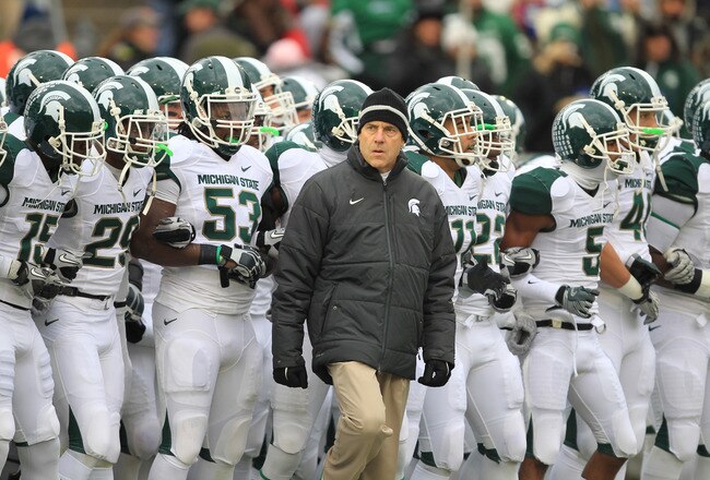 STATE COLLEGE, PA - NOVEMBER 27: Head coach Mark Dantonio of the Michigan State Spartans leads his team onto the field before a game against the Penn State Nittany Lions on November 27, 2010 at Beaver Stadium in State College, Pennsylvania. The Spartans won 28-22. (Photo by Hunter Martin/Getty Images)