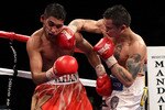 LAS VEGAS - DECEMBER 11:  (R-L) Marcos Maidana of Argentina connects with a right to the face of Amir Khan of England in the first round during the WBA super lightweight title fight at Mandalay Bay Events Center on December 11, 2010 in Las Vegas, Nevada.  (Photo by Scott Heavey/Getty Images)