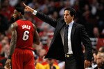 CHICAGO, IL - MAY 18:  Head coach Erik Spoelstra of the Miami Heat reacts as LeBron James #6 look on in the background against the Chicago Bulls in Game Two of the Eastern Conference Finals during the 2011 NBA Playoffs on May 18, 2011 at the United Center in Chicago, Illinois. NOTE TO USER: User expressly acknowledges and agrees that, by downloading and or using this photograph, User is consenting to the terms and conditions of the Getty Images License Agreement.  (Photo by Gregory Shamus/Getty Images)