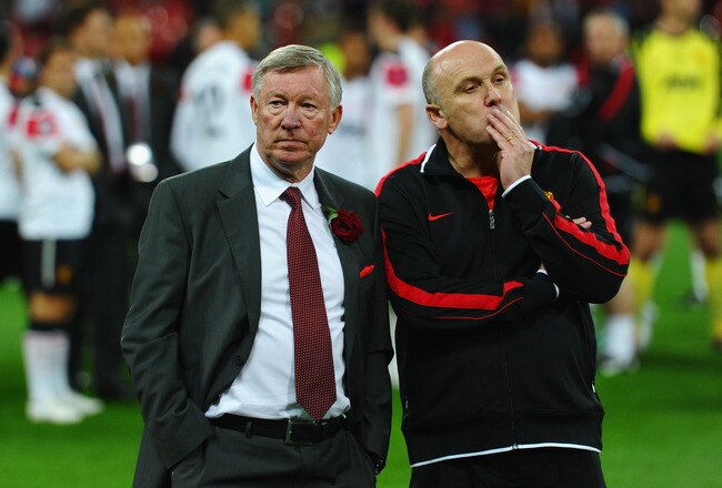 LONDON, ENGLAND - MAY 28:  Sir Alex Ferguson manager of Manchester United (L) and Mike Phelan assistant manager of Manchester United show their dejection after the UEFA Champions League final between FC Barcelona and Manchester United FC at Wembley Stadium on May 28, 2011 in London, England.  (Photo by Laurence Griffiths/Getty Images)