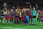 LONDON, ENGLAND - MAY 28:  Pedro of FC Barcelona (L) lifts the trophy as Barcelona celebrate in front of their fans after victory in the UEFA Champions League final between FC Barcelona and Manchester United FC at Wembley Stadium on May 28, 2011 in London, England.  (Photo by Jasper Juinen/Getty Images)