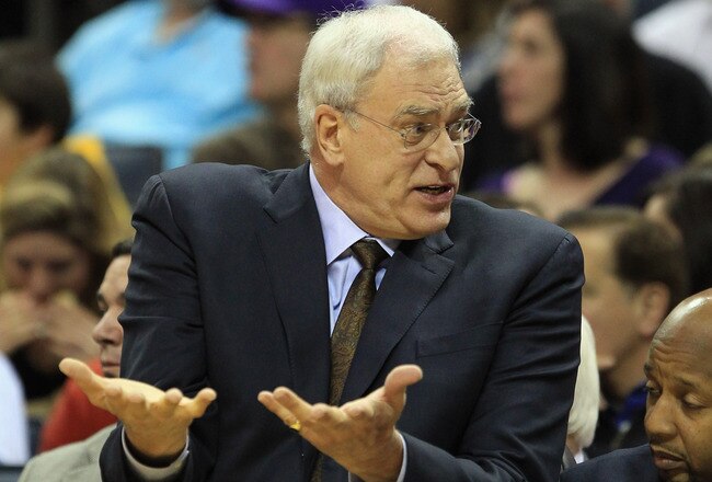 CHARLOTTE, NC - FEBRUARY 14:  Head coach Phil Jackson of the Los Angeles Lakers reacts to his bench against the Charlotte Bobcats during their game at Time Warner Cable Arena on February 14, 2011 in Charlotte, North Carolina. NOTE TO USER: User expressly acknowledges and agrees that, by downloading and/or using this Photograph, User is consenting to the terms and conditions of the Getty Images License Agreement.  (Photo by Streeter Lecka/Getty Images)