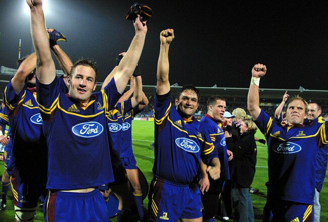 NEW ZEALAND - MAY 11:  The Highlanders (LR) Kelvin Middleton, Taine Randell Sam Harding and Jeff Wilson celebrate their win over the Reds  the Super 12 match between the Highlanders and the Reds played at Carisbrook, Saturday. The Highlanders won 4026.  (Photo by Michael Bradley/Getty Images)