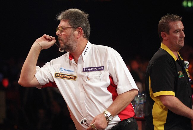FRIMLEY, ENGLAND - JANUARY 09:  Martin Adams of England (L) plays in the BDO World Darts Championship final against Dean Winstanley of England (R) at the Lakeside Country Club on January 9, 2011 in Frimley Green, England. The reigning champion Martin Adams is attempting to secure his third championship and claim the 100,000 GBP first prize.  (Photo by Oli Scarff/Getty Images)
