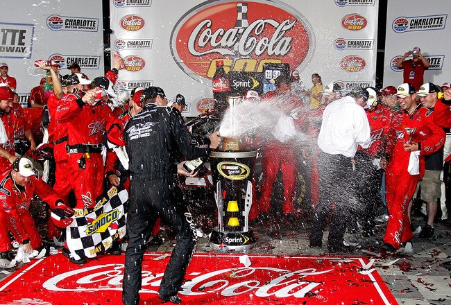 CONCORD, NC - MAY 29:  Kevin Harvick, driver of the #29 Budweiser Armed Forces Tribute Chevrolet, celebrates in Victory Lane after winning the NASCAR Sprint Cup Series Coca-Cola 600 at Charlotte Motor Speedway on May 29, 2011 in Concord, North Carolina.  (Photo by Geoff Burke/Getty Images for NASCAR)