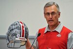COLUMBUS, OH - MARCH 30:  Head Coach Jim Tressel shows off a football helmet with military camouflage to the media during a press conference before the start of Spring practices at the Woody Hayes Athletic Center at The Ohio State University on March 30, 2011 in Columbus, Ohio. The Buckeyes will wear the helmets just during spring practice to honor the U.S. military.  (Photo by Jamie Sabau/Getty Images)