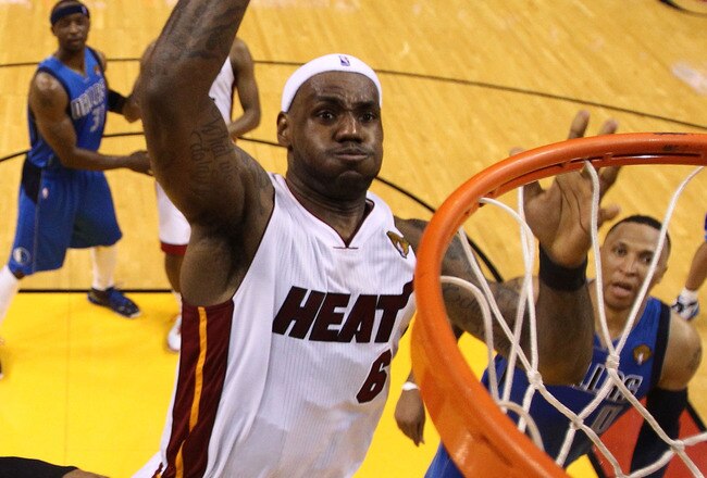 MIAMI, FL - MAY 31:  LeBron James #6 of the Miami Heat dunks the ball over Tyson Chandler #6 of the Dallas Mavericks in the fourth quarter in Game One of the 2011 NBA Finals at American Airlines Arena on May 31, 2011 in Miami, Florida. NOTE TO USER: User expressly acknowledges and agrees that, by downloading and/or using this Photograph, user is consenting to the terms and conditions of the Getty Images License Agreement.  (Photo by Mike Ehrmann/Getty Images)