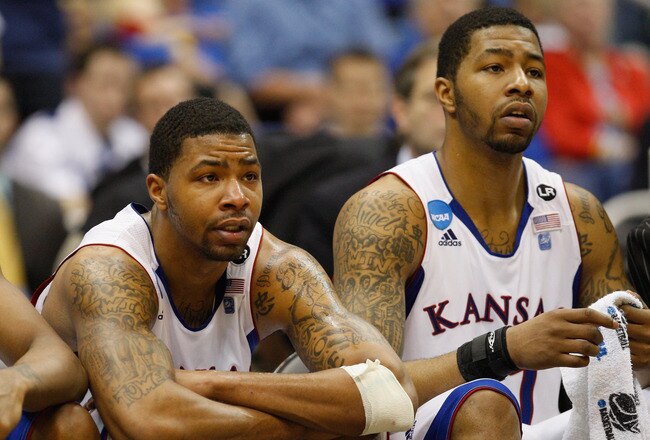 SAN ANTONIO, TX - MARCH 27:  Marcus Morris #22 and Markieff Morris #21 of the Kansas Jayhawks react during the southwest regional final of the 2011 NCAA men's basketball tournament at the Alamodome on March 27, 2011 in San Antonio, Texas. Virginia Commonwealth defeated Kansas 71-61.  (Photo by Ronald Martinez/Getty Images)