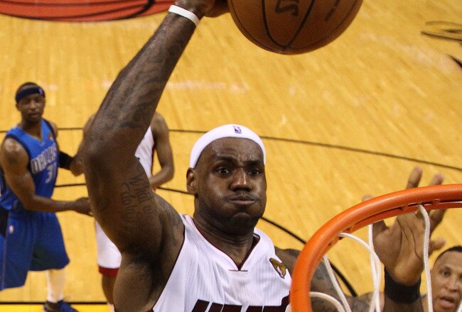 MIAMI, FL - MAY 31:  LeBron James #6 of the Miami Heat dunks the ball over Tyson Chandler #6 of the Dallas Mavericks in the fourth quarter in Game One of the 2011 NBA Finals at American Airlines Arena on May 31, 2011 in Miami, Florida. NOTE TO USER: User expressly acknowledges and agrees that, by downloading and/or using this Photograph, user is consenting to the terms and conditions of the Getty Images License Agreement.  (Photo by Mike Ehrmann/Getty Images)