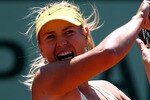 PARIS, FRANCE - JUNE 01:  Maria Sharapova of Russia hits a forehand during the women's singles quarterfinal match between Maria Sharapova of Russia and Andrea Petkovic of Germany on day eleven of the French Open at Roland Garros on June 1, 2011 in Paris, France.  (Photo by Clive Brunskill/Getty Images)