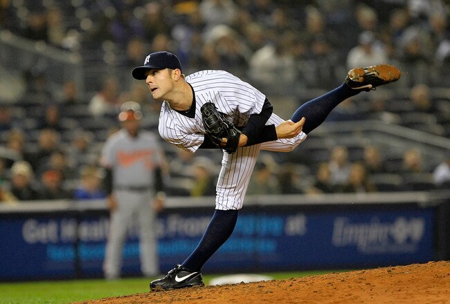 NEW YORK, NY - APRIL 06:  David Robertson #30 of the New York Yankees pitches against the Baltimore Orioles at Yankee Stadium on April 13, 2011 in the Bronx borough of New York City.  (Photo by Chris Trotman/Getty Images)