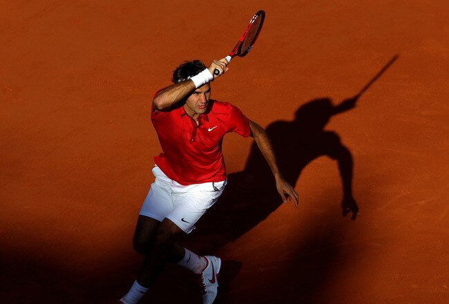 PARIS, FRANCE - MAY 31:  Roger Federer of Switzerland hits a forehand during the men's singles quarterfinal match between Gael Monfils of France and Roger Federer of Switzerland on day ten of the French Open at Roland Garros on May 31, 2011 in Paris, France.  (Photo by Clive Brunskill/Getty Images)