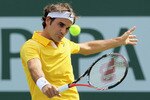 INDIAN WELLS, CA - MARCH 19:  Roger Federer of Switzerland returns a backhand to Novak Djokovic of Serbia during the semifinals of the BNP Paribas Open at the Indian Wells Tennis Garden on March 19, 2011 in Indian Wells, California.  (Photo by Jeff Gross/Getty Images)