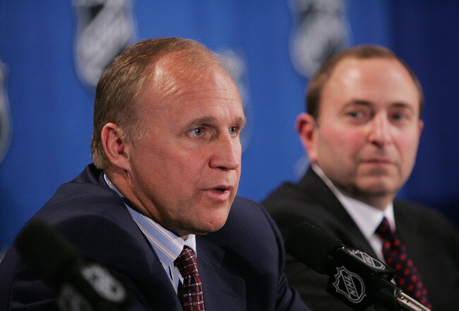 NEW YORK - JULY 22:  Colin Campbell (L), Executive Vice President and Director of Hockey Operations, and Commissioner Gary Bettman of the National Hockey League address the media regarding NHL rules changes and the new CBA agreement at the Sheraton New York Hotel and Towers on July 22, 2005 in New York City.  (Photo by Bruce Bennett/Getty Images for NHLI)