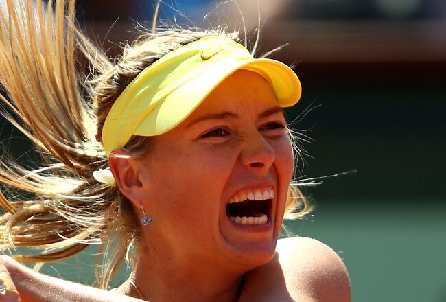 PARIS, FRANCE - JUNE 02:  Maria Sharapova of Russia hits a backhand during the women's singles semi final match between Na Li of China and Maria Sharapova of Russia on day twelve of the French Open at Roland Garros on June 2, 2011 in Paris, France.  (Photo by Clive Brunskill/Getty Images)