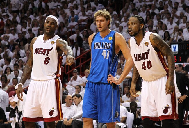 MIAMI, FL - MAY 31:  LeBron James #6 (L) and Udonis Haslem #40 of the Miami Heat look on as they Dirk Nowitzki #41 of the Dallas Mavericks stands between them as they await a free throw attempt in Game One of the 2011 NBA Finals at American Airlines Arena on May 31, 2011 in Miami, Florida. NOTE TO USER: User expressly acknowledges and agrees that, by downloading and/or using this Photograph, user is consenting to the terms and conditions of the Getty Images License Agreement.  (Photo by Mike Ehrmann/Getty Images)