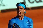 PARIS, FRANCE - JUNE 01:  Rafael Nadal of Spain celebrates a point during the men's singles quarterfinal match between Rafael Nadal of Spain and Robin Soderling of Sweden on day eleven of the French Open at Roland Garros on June 1, 2011 in Paris, France.  (Photo by Alex Livesey/Getty Images)