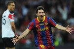 LONDON, ENGLAND - MAY 28:  Lionel Messi of FC Barcelona celebrates scoring his teams second goal during the UEFA Champions League final between FC Barcelona and Manchester United FC at Wembley Stadium on May 28, 2011 in London, England.  (Photo by Jasper Juinen/Getty Images)