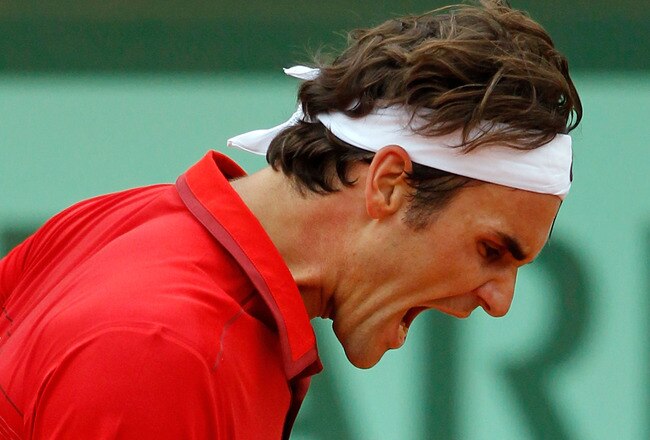 PARIS, FRANCE - JUNE 03:  Roger Federer of Switzerland celebrates a point during the men's singles semi final match between Roger Federer of Switzerland and Novak Djokovic of Serbia on day thirteen of the French Open at Roland Garros on June 3, 2011 in Paris, France.  (Photo by Matthew Stockman/Getty Images)
