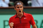 PARIS, FRANCE - JUNE 03:  Roger Federer of Switzerland celebrates a point during the men's singles semi final match between Roger Federer of Switzerland and Novak Djokovic of Serbia on day thirteen of the French Open at Roland Garros on June 3, 2011 in Paris, France.  (Photo by Matthew Stockman/Getty Images)