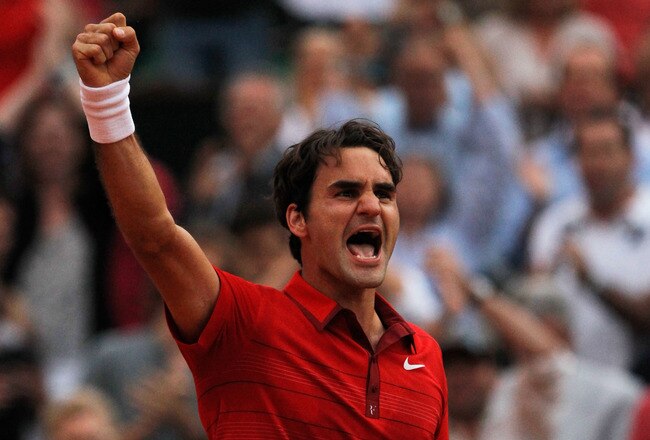 PARIS, FRANCE - JUNE 03:  Roger Federer of Switzerland celebrates match point during the men's singles semi final match between Roger Federer of Switzerland and Novak Djokovic of Serbia on day thirteen of the French Open at Roland Garros on June 3, 2011 in Paris, France.  (Photo by Matthew Stockman/Getty Images)