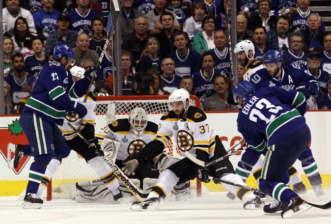 VANCOUVER, BC - JUNE 01:  Alexander Edler #23 of the Vancouver Canucks takes a shot against Tim Thomas #30 of the Boston Bruins during game one of the 2011 NHL Stanley Cup Finals at Rogers Arena on June 1, 2011 in Vancouver, Canada.  (Photo by Bruce Bennett/Getty Images)